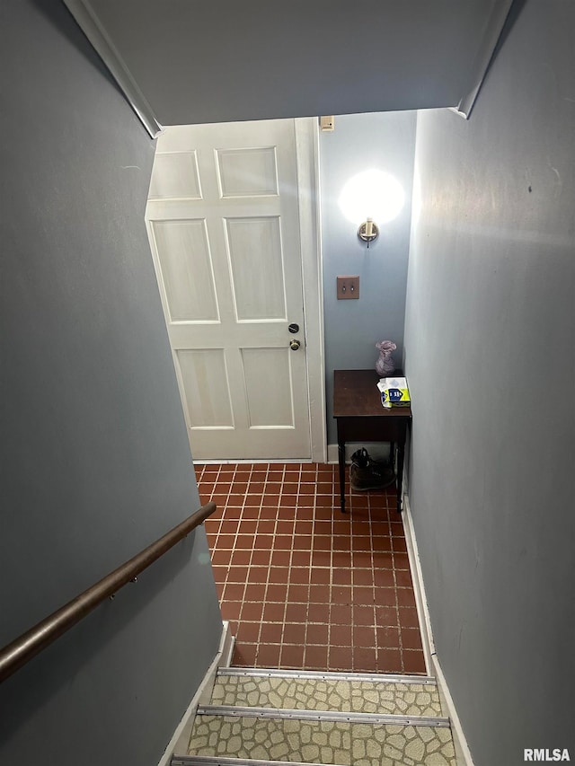 entryway featuring dark tile patterned flooring