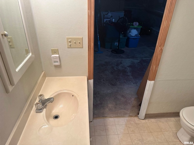 bathroom with tile patterned floors, sink, and toilet