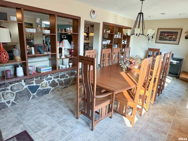 dining room with a notable chandelier