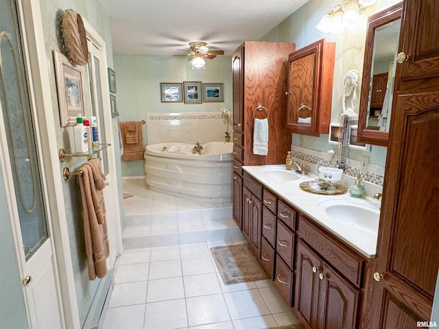 bathroom featuring vanity, ceiling fan, a bathtub, and tile patterned flooring