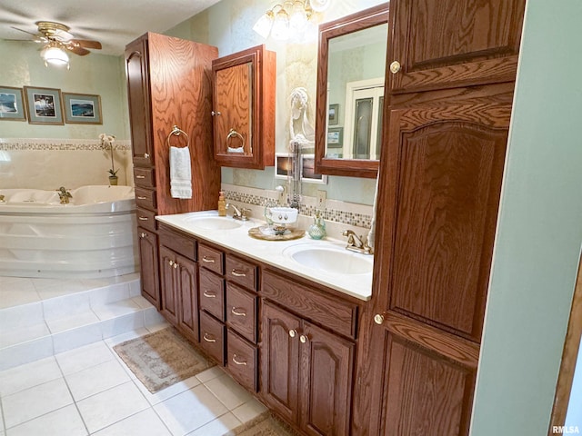 bathroom featuring vanity, tile patterned floors, ceiling fan, and a bathing tub