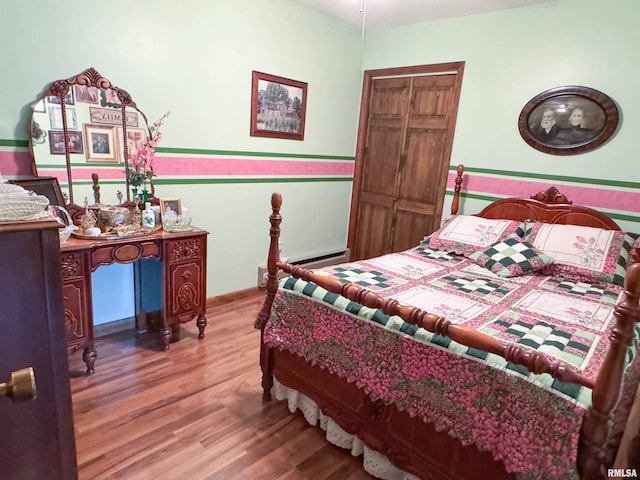 bedroom with hardwood / wood-style floors