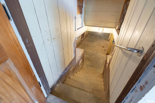 stairway with wooden walls