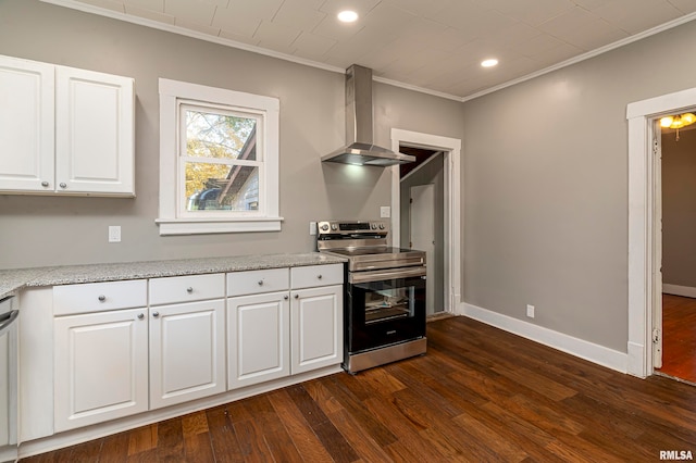 kitchen featuring wall chimney exhaust hood, ornamental molding, white cabinets, appliances with stainless steel finishes, and dark hardwood / wood-style flooring