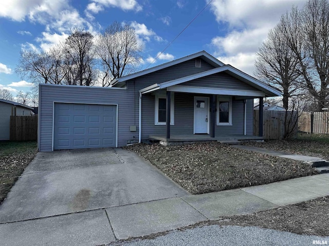 view of front of property with covered porch and a garage