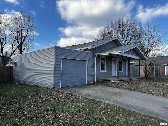 view of front of home featuring a garage and covered porch