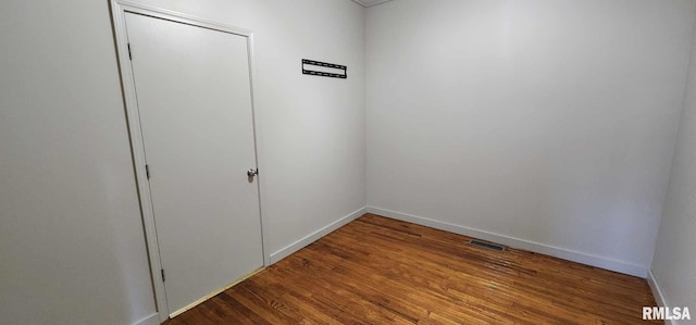 empty room featuring wood-type flooring