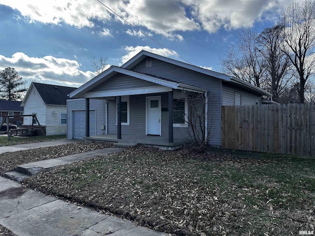 view of front of house with covered porch and a garage