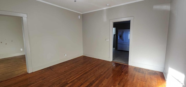 unfurnished room with dark hardwood / wood-style floors and ornamental molding