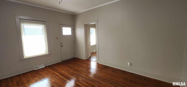 entryway with dark hardwood / wood-style flooring and crown molding