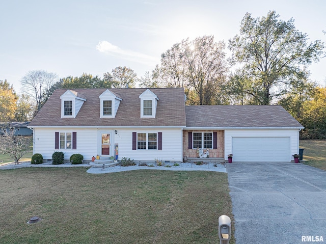 new england style home with a front yard and a garage