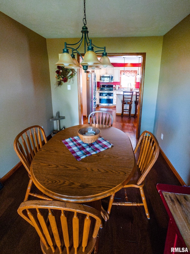 dining space featuring hardwood / wood-style floors