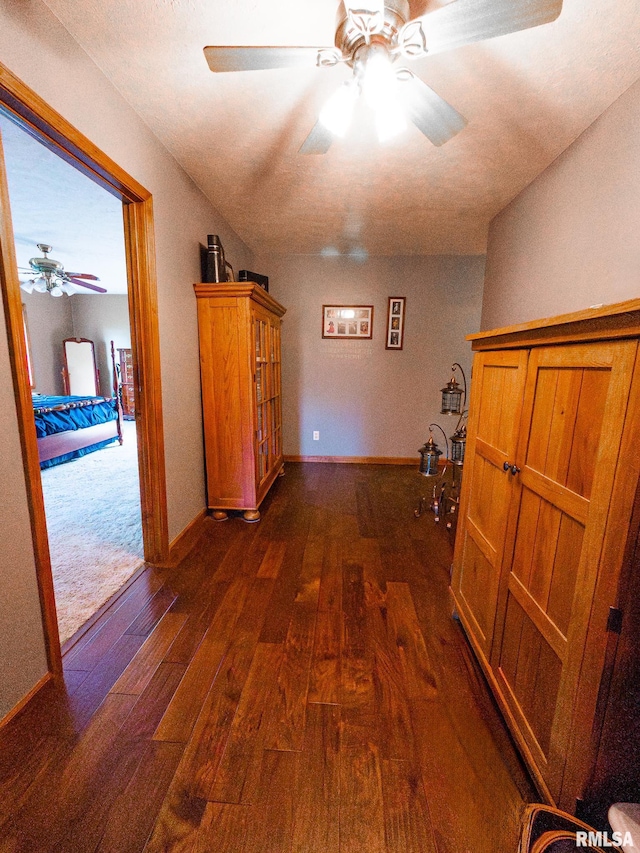 hall with dark wood-type flooring