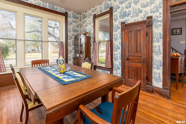 dining area with plenty of natural light and light wood-type flooring