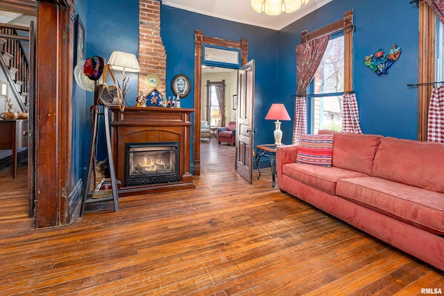 living room featuring hardwood / wood-style flooring and a fireplace