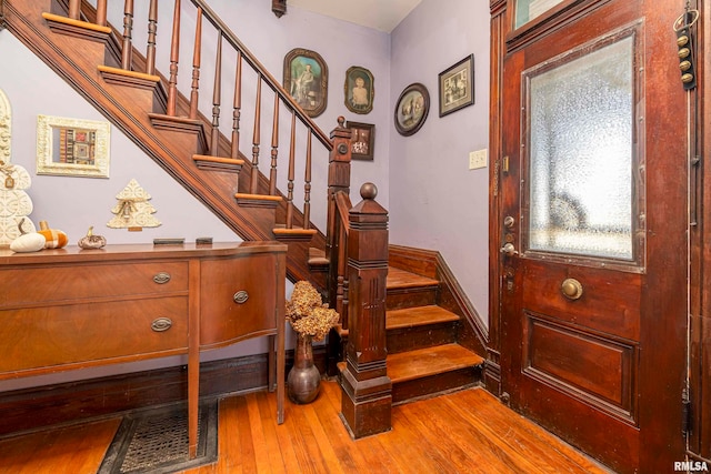 stairway featuring hardwood / wood-style flooring