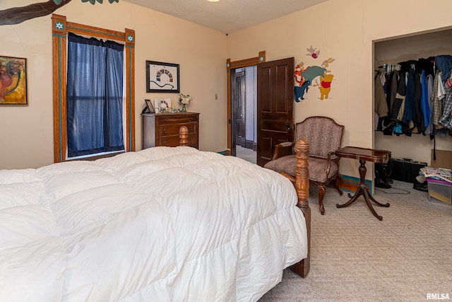 carpeted bedroom featuring a closet