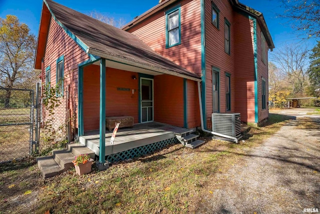 back of house featuring central AC