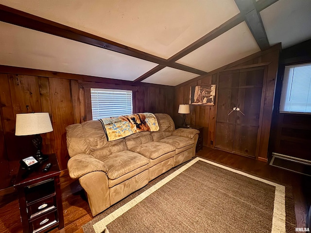 living room with dark wood-type flooring, vaulted ceiling with beams, and wooden walls