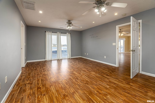 spare room featuring wood-type flooring