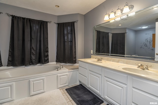 bathroom with tile patterned flooring, vanity, and a washtub