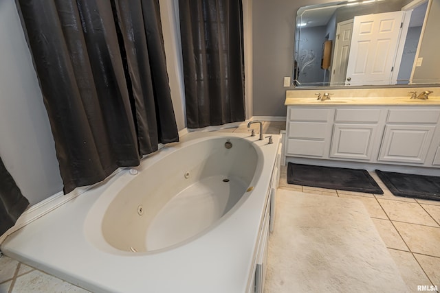 bathroom featuring tile patterned floors, vanity, and a bathtub