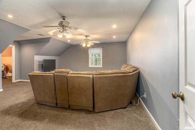 carpeted living room with lofted ceiling, a textured ceiling, and ceiling fan