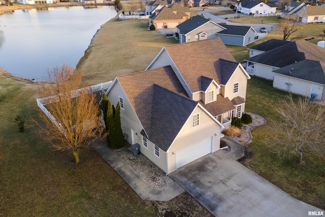 birds eye view of property featuring a water view