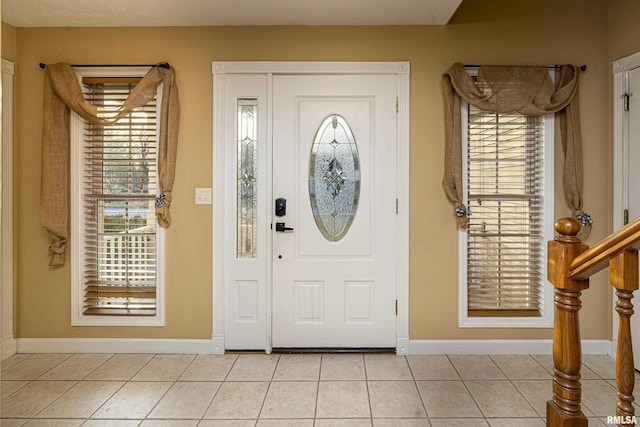 foyer with light tile patterned floors