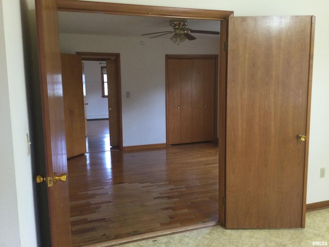 empty room featuring hardwood / wood-style floors and ceiling fan