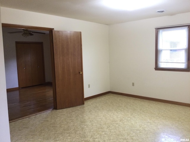 empty room featuring light wood-type flooring and ceiling fan