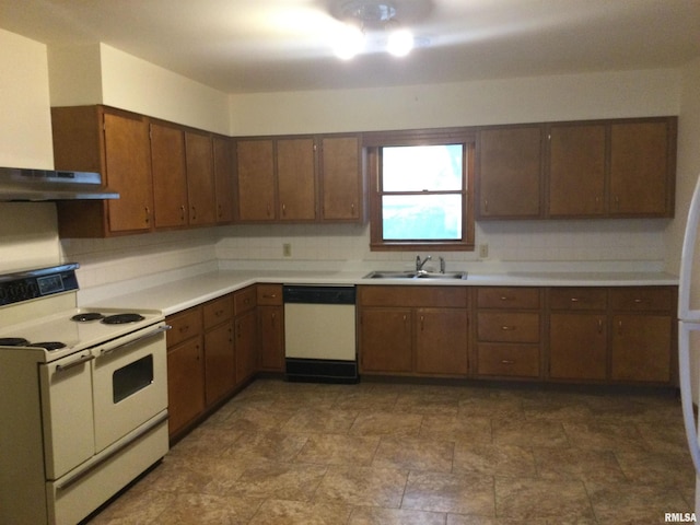 kitchen with range hood, sink, decorative backsplash, and white appliances