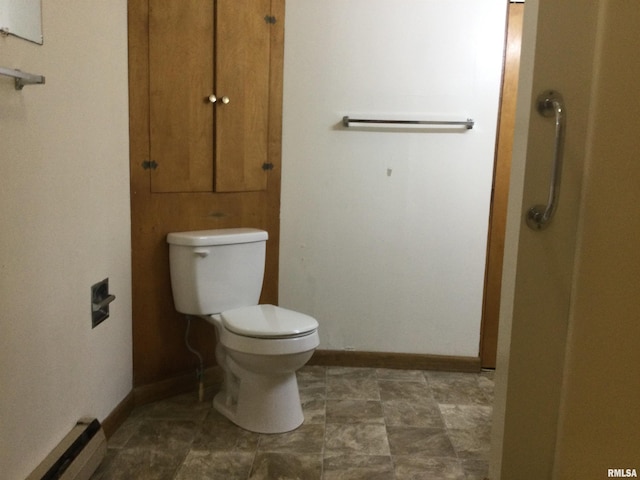 bathroom with a baseboard radiator and toilet