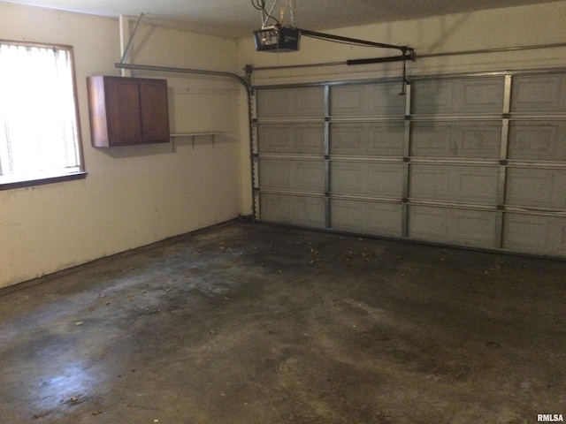 garage featuring a garage door opener