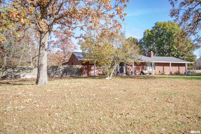 view of front of home with a front lawn