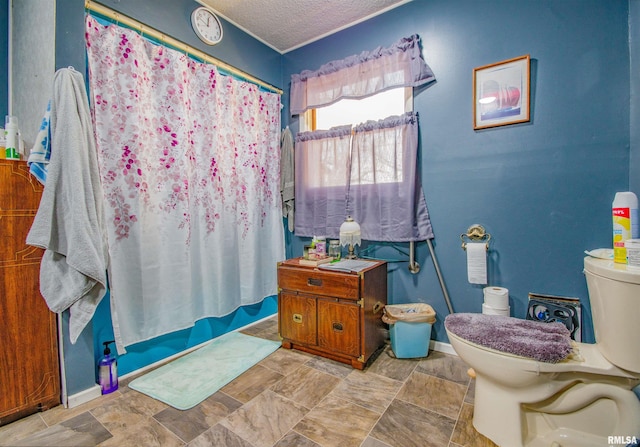 2857 State Route 161st Hwy, Centralia, IL 62801 - full bath featuring toilet, a textured ceiling, baseboards, and stone finish flooring