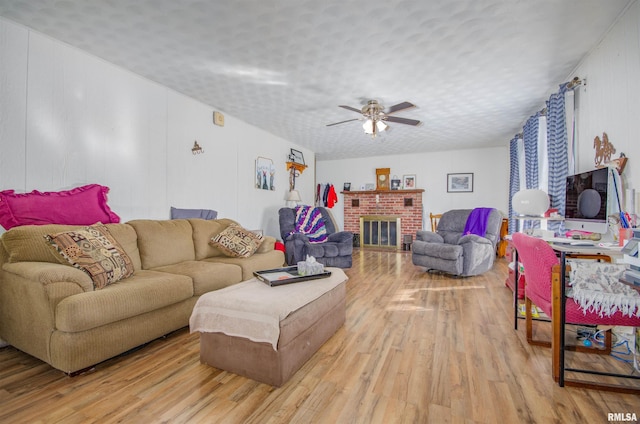 2857 State Route 161st Hwy, Centralia, IL 62801 - living area featuring wood finished floors, ceiling fan, and a brick fireplace