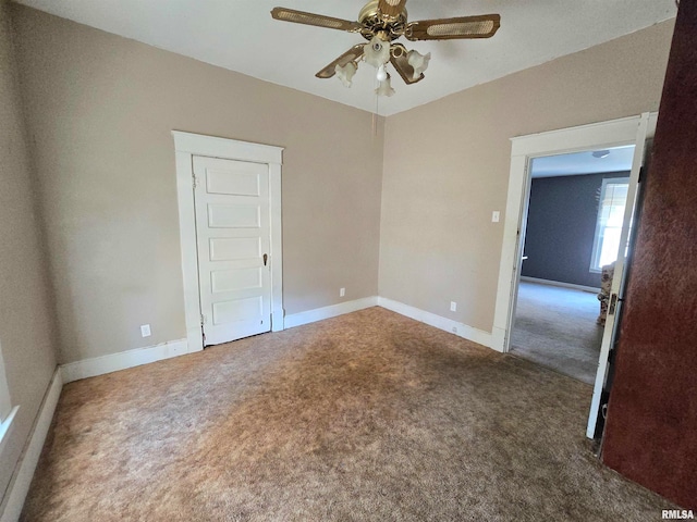 empty room with ceiling fan and carpet floors