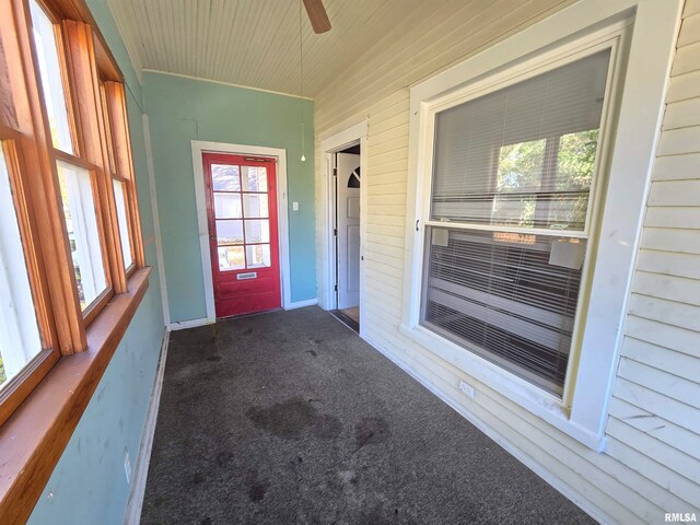 property entrance with ceiling fan