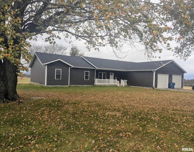 view of front facade with a garage and a front lawn