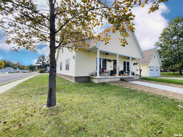 view of front of property with a garage, a porch, and a front yard