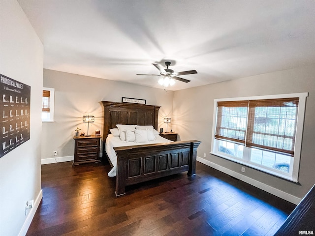 bedroom featuring dark hardwood / wood-style flooring and ceiling fan