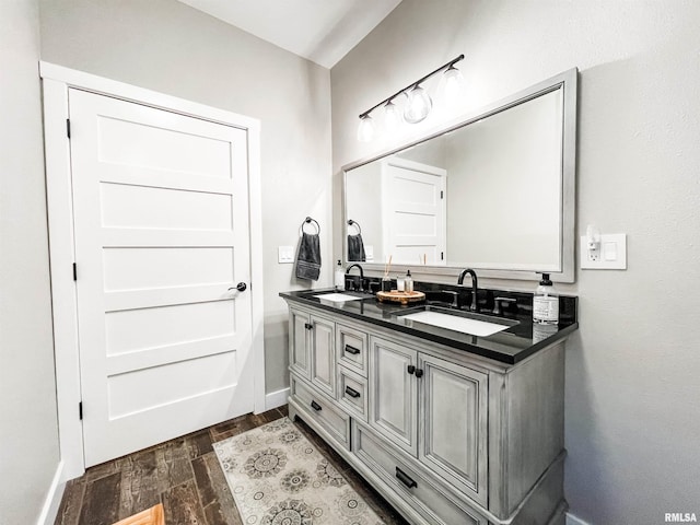 bathroom featuring hardwood / wood-style floors and vanity