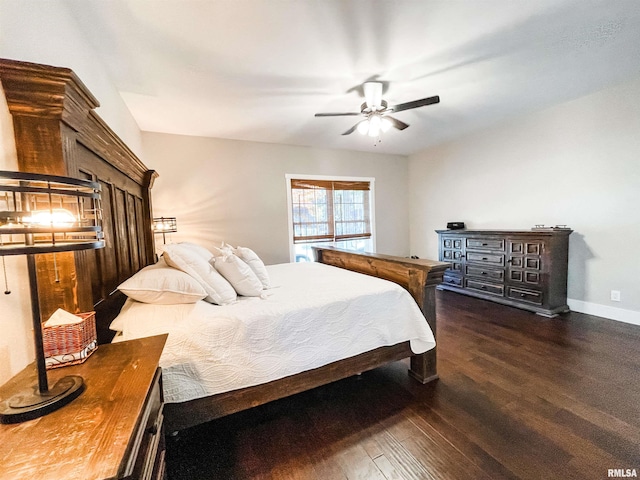 bedroom featuring dark hardwood / wood-style flooring and ceiling fan