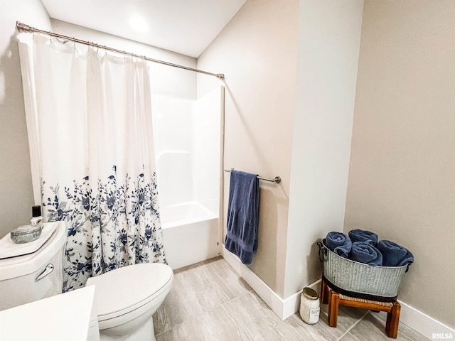 bathroom featuring toilet and shower / tub combo