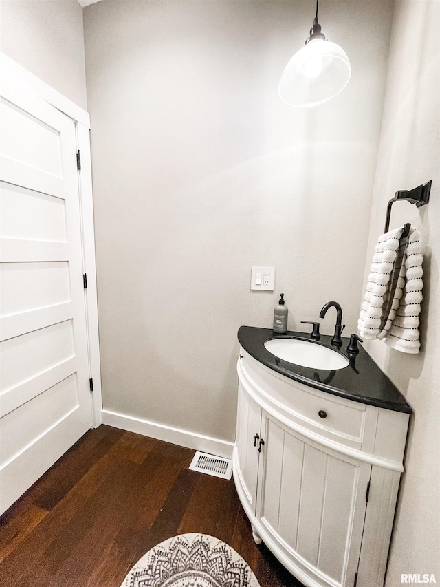 bathroom with wood-type flooring and vanity