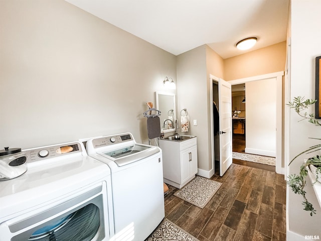 washroom with separate washer and dryer, cabinets, sink, and dark hardwood / wood-style floors