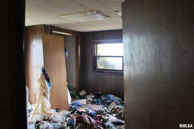 miscellaneous room featuring wooden walls