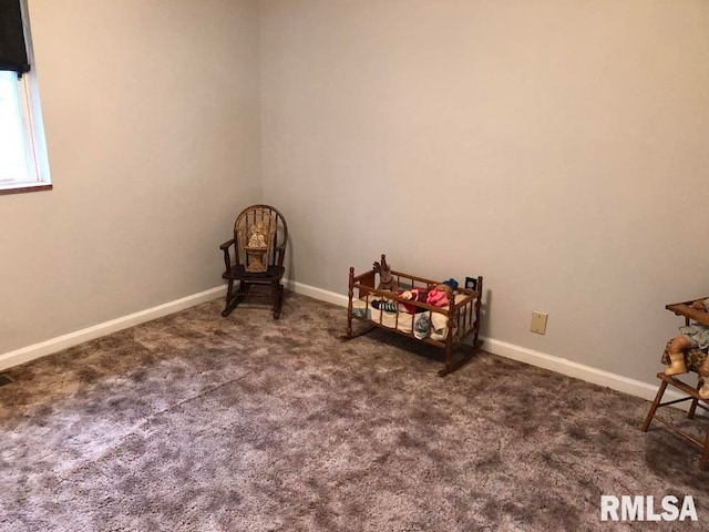 interior space featuring dark colored carpet