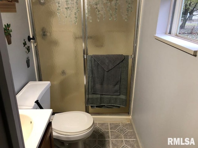 bathroom with toilet, an enclosed shower, vanity, and tile patterned flooring